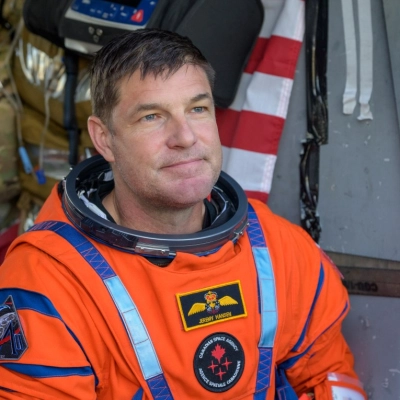 CSA (Canadian Space Agency) astronaut Jeremy Hansen, Artemis II mission specialist is seen sitting in a Navy MH-60 Seahawk from...