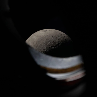 art002e012278 (April 6, 2026) - The Moon seen peeking above the window sill of the Orion spacecraft during the Artemis...
